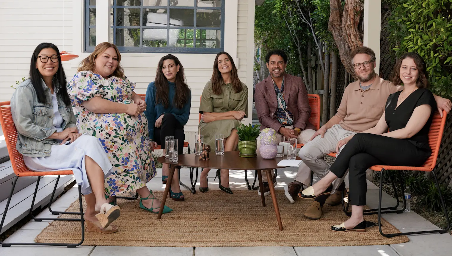 Seven people sitting in a semicircle and smiling at the camera. Among the group are: Seth and Lauren Miller Rogen; cast members of NBC’s “This Is Us” Mandy Moore, Chrissty Metz and Jon Huertas; series executive producer KJ Steinberg; and Caring Across Generations’ Executive Director Ai-jen Poo. Photo credit: Maya Minhas / Caring Across Gen